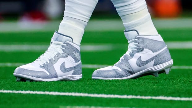 Dallas Cowboys quarterback Dak Prescott's white and grey Air Jordan cleats.